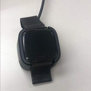 Fitbit Versa with charging station.